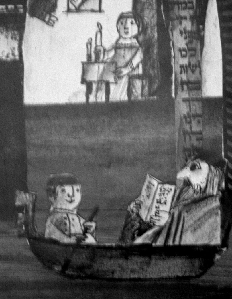 Illustrative painting showing a bearded figure of Jewish appearance reading in a small boat, accompanied by a young boy. In the background, within a house structure, a figure lights candles. Hebrew inscriptions appear on a vertical element of the décor.